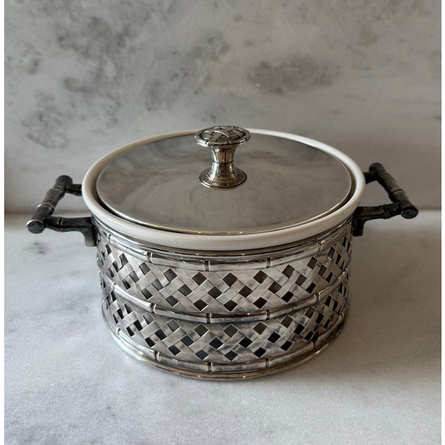 Vintage serving crock resting in a handled silver plate frame with faux bamboo design. The white crock is made by Hall and...