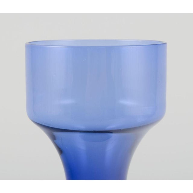 Bo Borgström for Åseda, Swedish glass artist. Art glass vase in blue and orange. Large glass bubble at the bottom....