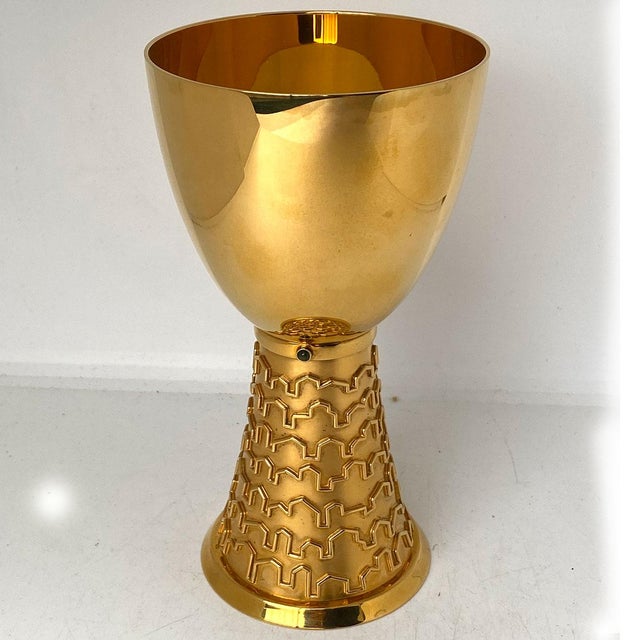 DETAILS A contemporary gilt silver ecclesiastical chalice by the German workshop Bernd Cassau. Inset with round semi-...