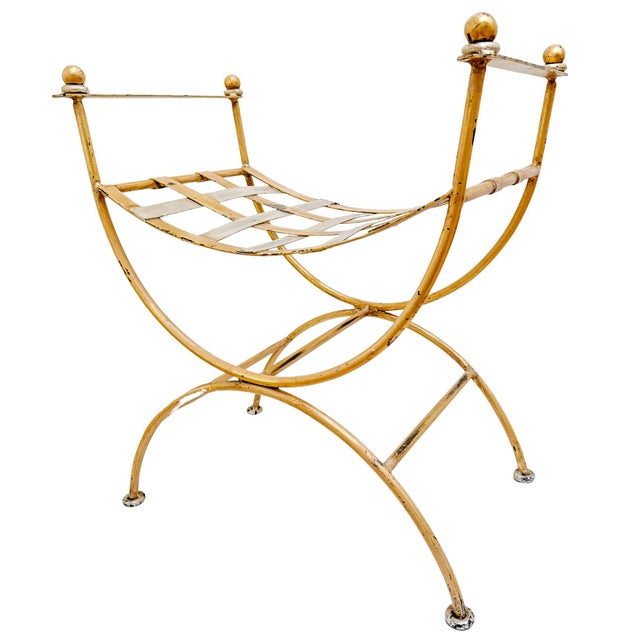 A striking vintage curule vanity stool / bench featuring a sculptural X-frame design that blends neoclassical roots with...