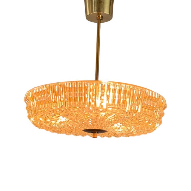 A beautiful and rare pair of vintage Orrefors ceiling lamps, designed by Carl Fagerlund in the 1960s. These iconic pieces...