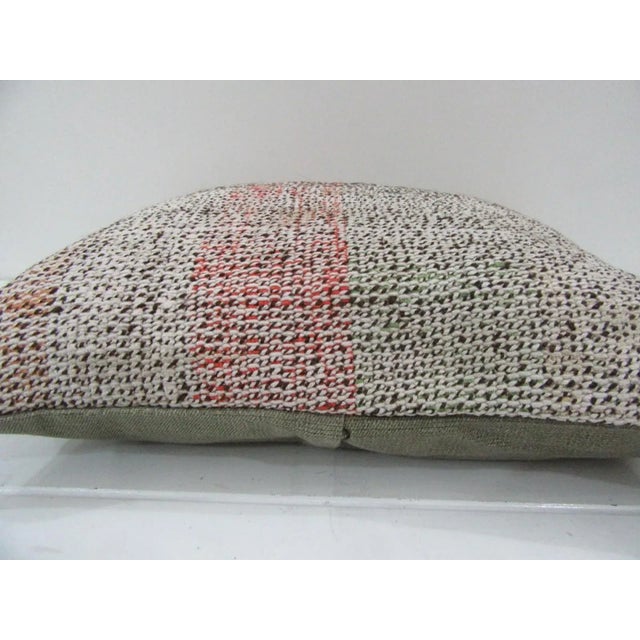 This is a pillow cover made from a vintage kilim rug. The piece was properly washed and ready to use. Pillow inserts not...