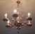 Impressive vintage Boho gilt brass chandelier, 6 arms decorated with ceramic roses. Up to 250V (Europe/UK Standard).The...