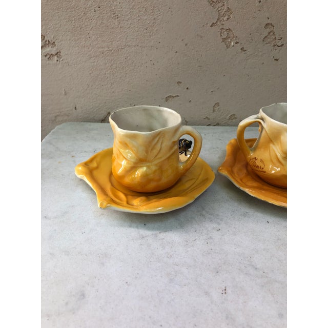A pair of Majolica cups and plate with cicada signed Sicart Circa 1950.