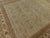 This extra fine hand-knotted rug, from Nasser Luxury Rugs, features intricate paisley floral pattern in cream, gold, tan...