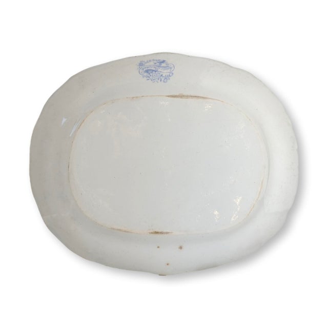 A most genteel addition to any well-appointed table, this 19th-century English ironstone platter bears the iconic Asiatic...