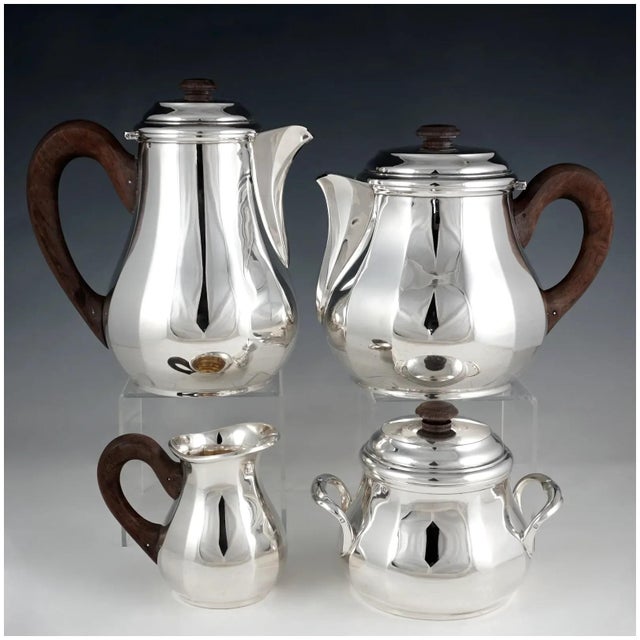 Art Deco French sterling silver tea and coffee set, ca. 1920-1930. This set comprises of 4 pieces: 42 oz coffee pot, 48 oz...