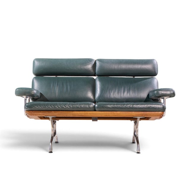 Charles & Ray Eames for Herman Miller Model ES108 Mid Century Walnut and Leather Two-Seat Sofa This sofa measures: 56.5...