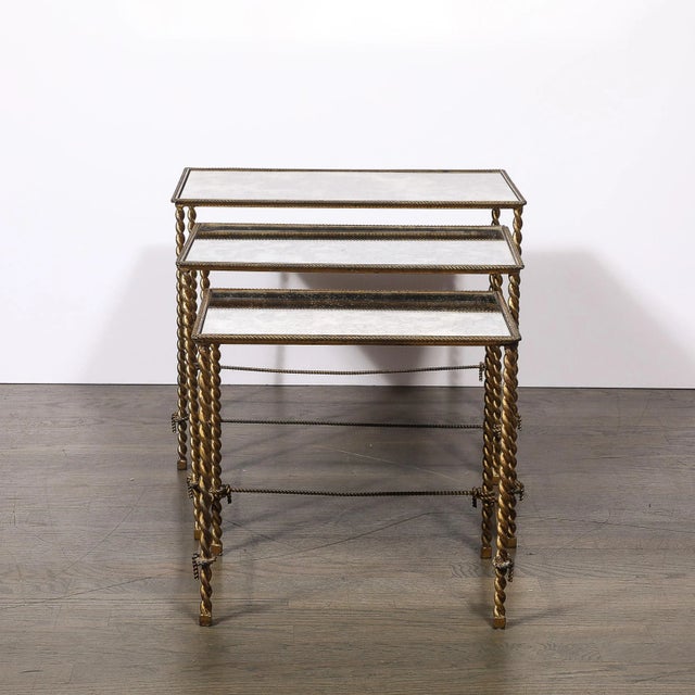This exquisite set of three nesting tables, crafted in America circa 1930, exemplifies the elegance and sophistication of...
