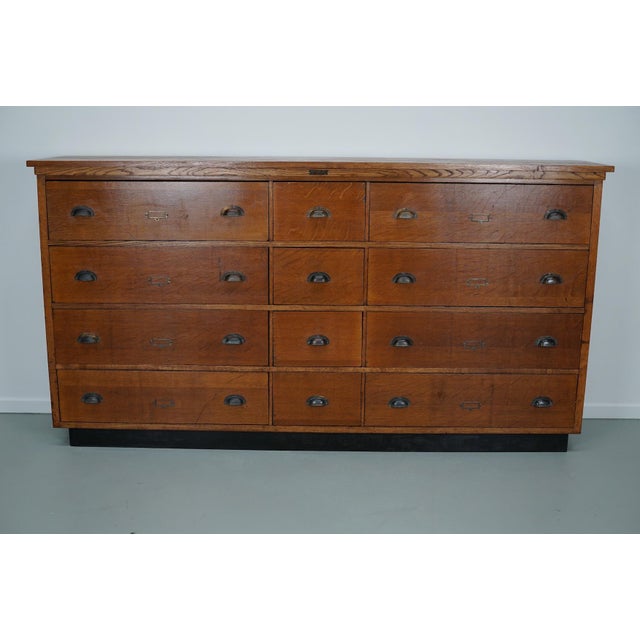 This apothecary cabinet was made circa 1930s in the Netherlands by the company Nefkens in Breda. It features 12 drawers in...