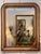 The classic Louis Philippe form with rounded upper corners and a molded giltwood frame showing warm, even patina. A beaded...