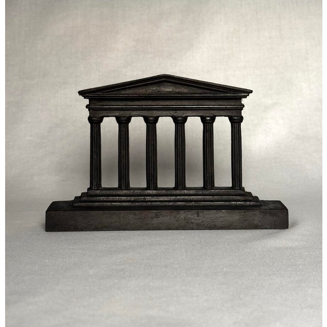 This replica of the Parthenon in Greece is designed with six vertical doric/ionic columns resting on a rectangular base...