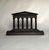 This replica of the Parthenon in Greece is designed with six vertical doric/ionic columns resting on a rectangular base...