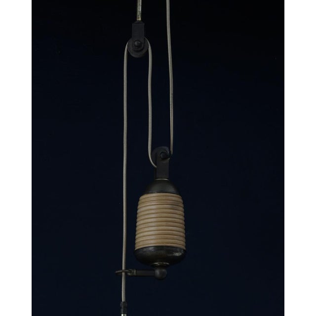 A very rare item. An adjustable vintage lamp made of brass and a distinctive material known as pencil reed (thin strips of...