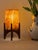 Comet pairs a hand-carved Egyptian alabaster shade with a geometric walnut base, combining contemporary form with...