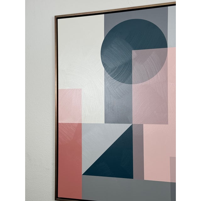 Abstract print art of pink pattern. Thin floater frame in brass finish.