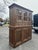 Beautifully crafted wood cabinet hutch made circa 2010s in the Rustic Farmhouse / Transitional style, featuring three...