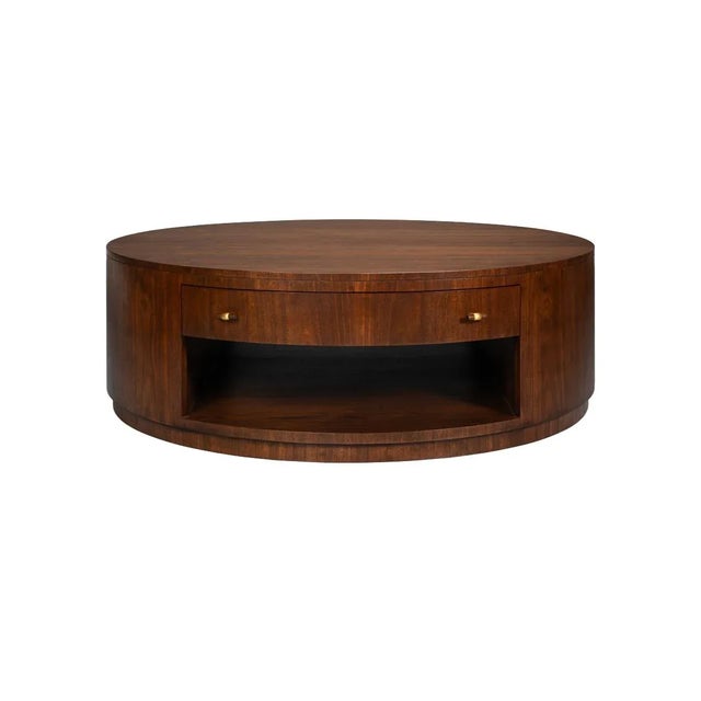 Round coffee table combines timeless design with everyday functionality. Crafted in a warm walnut finish, this striking...