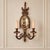 Add distinctive European character to your interior with this ornate bronze two-light wall sconce featuring an integrated...