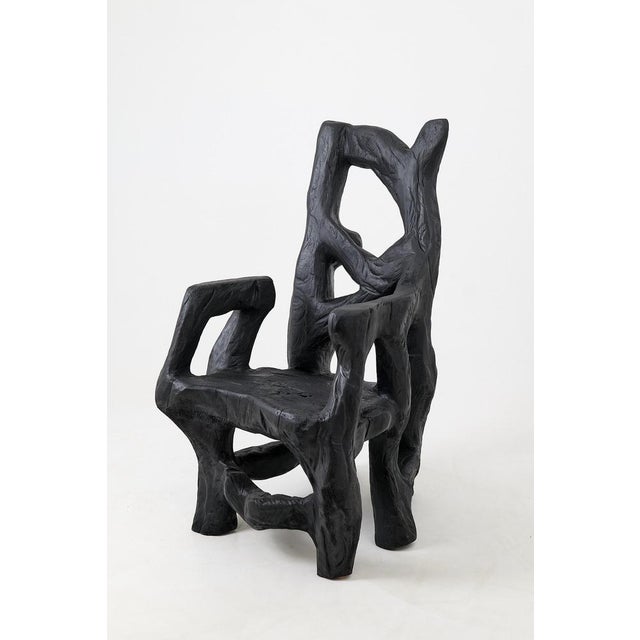 There are very few objects that can genuinely be called both a chair and a sculpture. This is one of them. Carved from a...