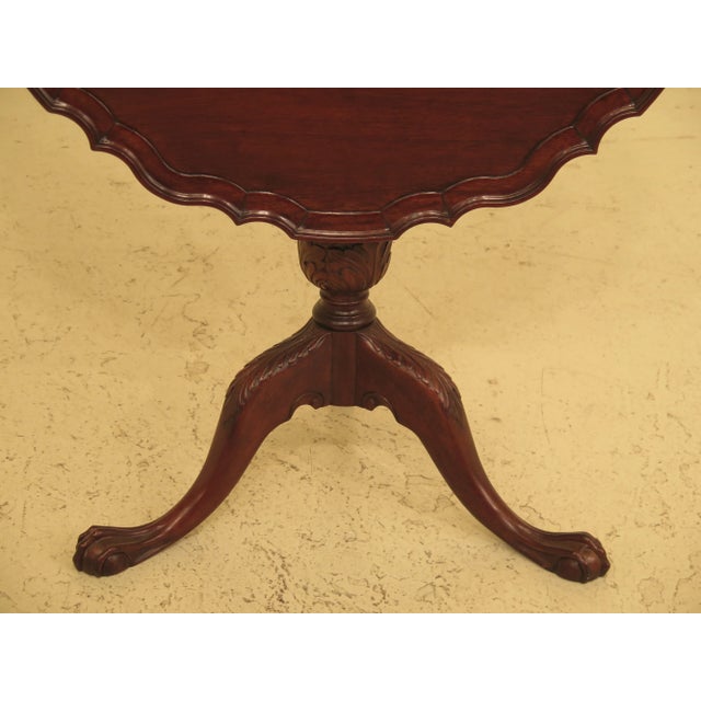 Chippendale 18th c. style mahogany tilt top table. Features nice carved Details and nice pie crust top. Table was...