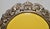 Sterling silver domed top photo frame with a beveled glass cover. Mahogany-backed panel. Domed top with scalloped design...