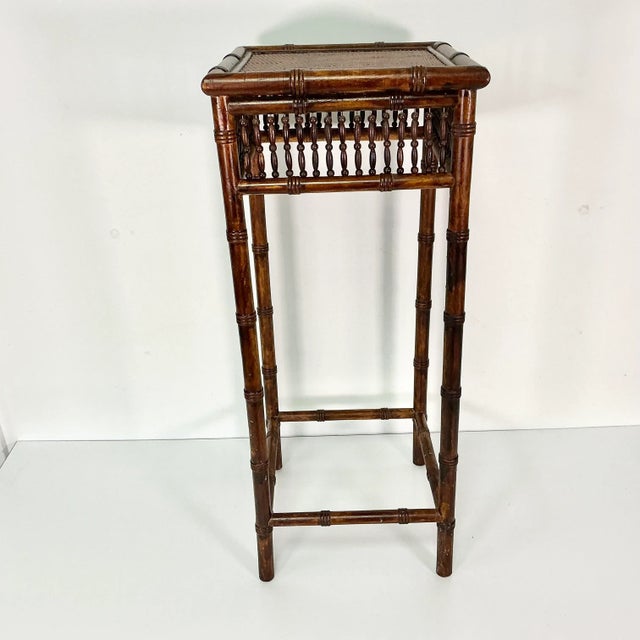 This lovely dark stained plant stand has a beautiful wood bead apron around the top. Its wood legs and supports are in the...