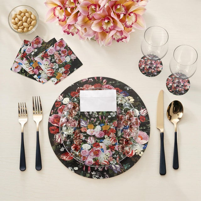 Add an elegant decorative element to any table with our Festoon Flowers Vegan Leather Round Pebble Placemat, inspired by...