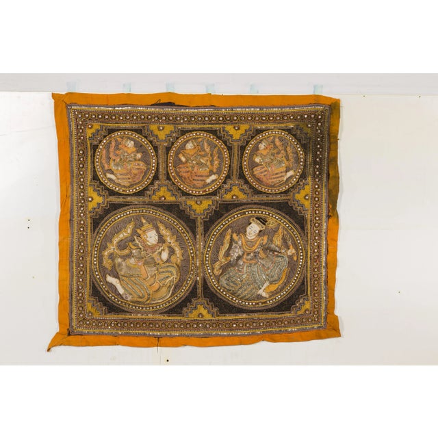 A 19th century Burmese Kalaga tapestry with stones, sequins and golden thread. Immerse yourself in the grandeur of Burmese...