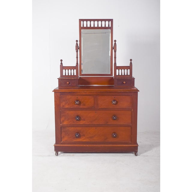 Dressing table with two drawers. In warm-toned wood, it has a sturdy structure with five drawers, two smaller at the top...