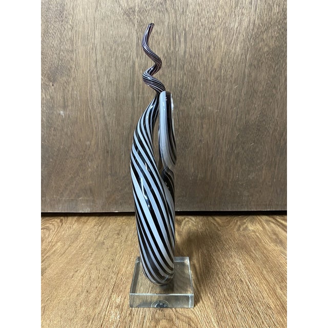 Capture a moment of frozen motion with this striking sculptural work of art. Evocative of the master glassmakers of...