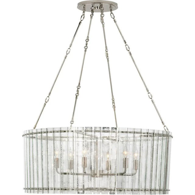 Cadence Large Chandelier in Polished Nickel with Antique Mirror Designer: Carrier and Company Fixture Height: 15.75" Min....