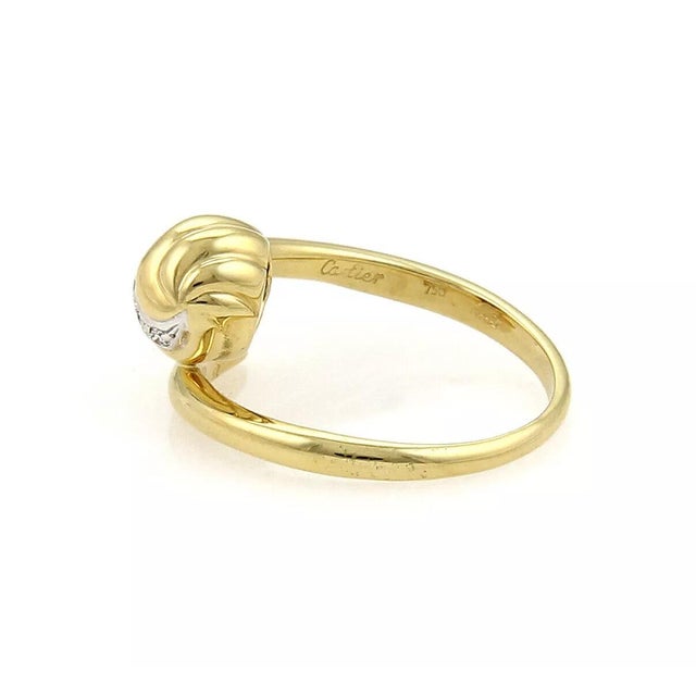This elegant authentic ring is from Cartier, it is crafted from solid 18k yellow gold with white gold accent and features...