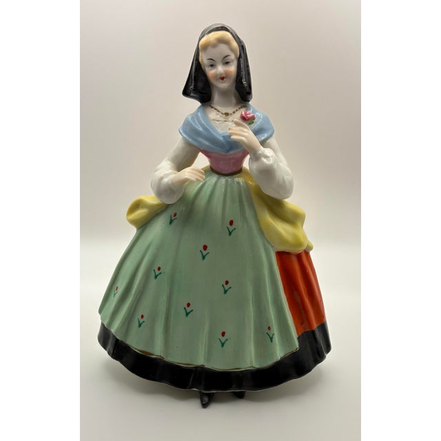 Vintage glazed porcelain figurine produced by Ardalt for Lenwile China, Japan. The figure depicts a woman in traditional...