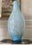 Suspended gold and silver flecks catch the light in this tall 1970s Italian Murano-style handblown blue teardrop art glass...