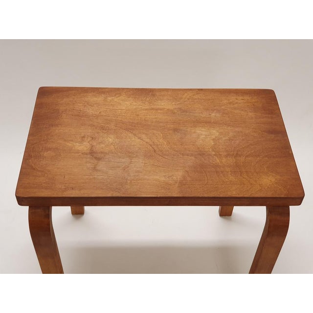 An L-legged side table designed by Alvar Aalto and manufactured by Artek. The table is from the 1950s-60s. The table is...