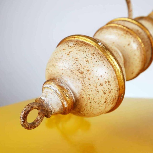 Item : this elegant vintage chandelier, dating back to the 1960s, is crafted from wood with a white and gold finish that...