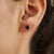 A Pair of Moody Blue Sapphire Oval Solitaire Stud Earrings in 925 Silver - Minimalist Luxe brings understated elegance to...