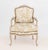 Louis XV Style Upholstered Fauteuil, the upholstered seat, arms, and back with Chinoiserie style pattern, the cerused wood...