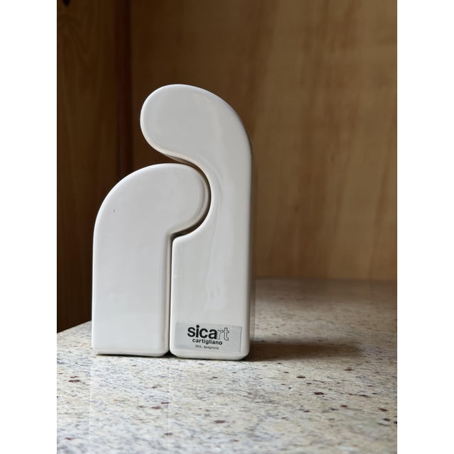 Elevate your dining table with this stunning example of 1970s Italian design. These interlocking salt and pepper shakers...