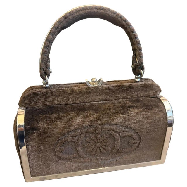 This high-quality 1970s Italian evening bag is a sophisticated blend of rich texture and sleek metallic accents, perfectly...