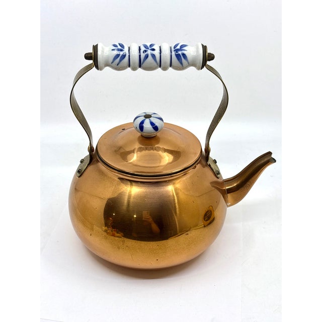 Vintage copper tea kettle with ceramic delft style handle. The tea kettle is made in Korea in the 1970s. Very nice...