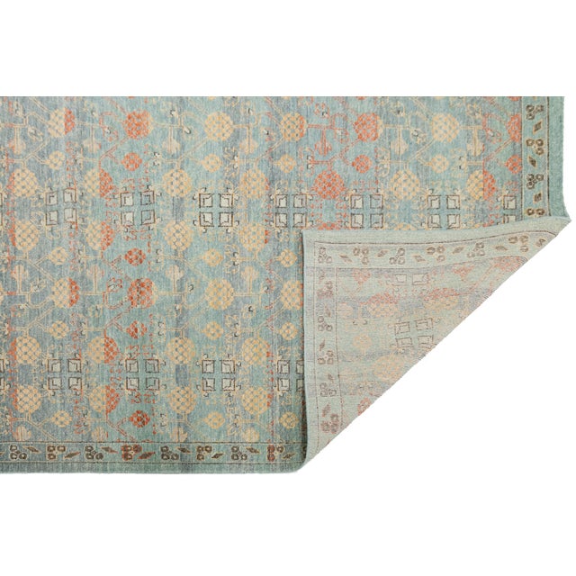 Elevate your space with this elegant, modern Apadana's Khotan-style wool area rug. Inspired by classic East Turkestan...