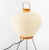 Isamu Noguchi (American, 1904-1988) "Akari 3A" Table Lamp, with bulbous washi paper shade and patinated steel tripod base,...