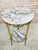 Elegant French guéridon table dating from the late 19th to early 20th century. The table features a circular marble top...