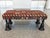 This vintage ottoman bench was made in the 1940s. The upholstery is a converted, richly patterned Kilim rug with a palette...
