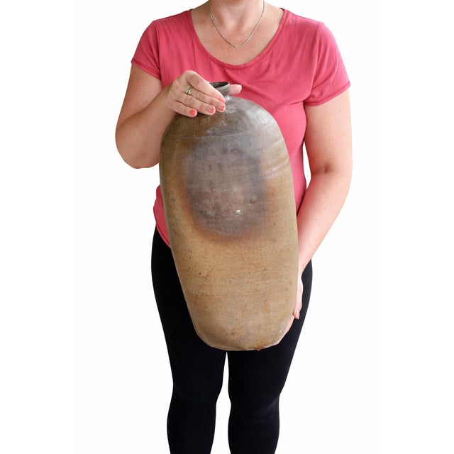 This authentic late 19th century Hungarian terracotta oil vessel is a remarkable example of traditional rural folk...