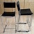 Set of four vintage modern counter height stools made of steel and leather offer high style to any space. Upholstered in...