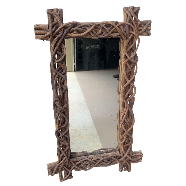 A true piece of Adirondack-style folk art. This vintage mirror features a hand-woven frame of natural branches, twisted...