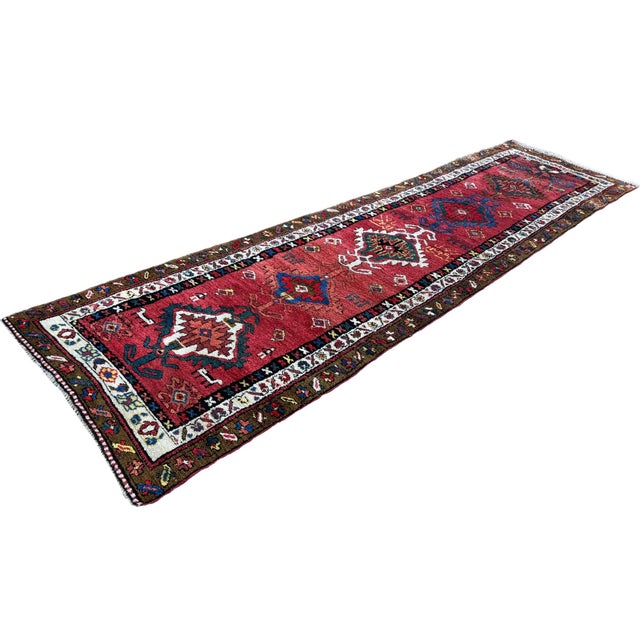 A fabulous antique Heriz runner, woven in the first quarter of the C20th. The design features a series of geometrical...